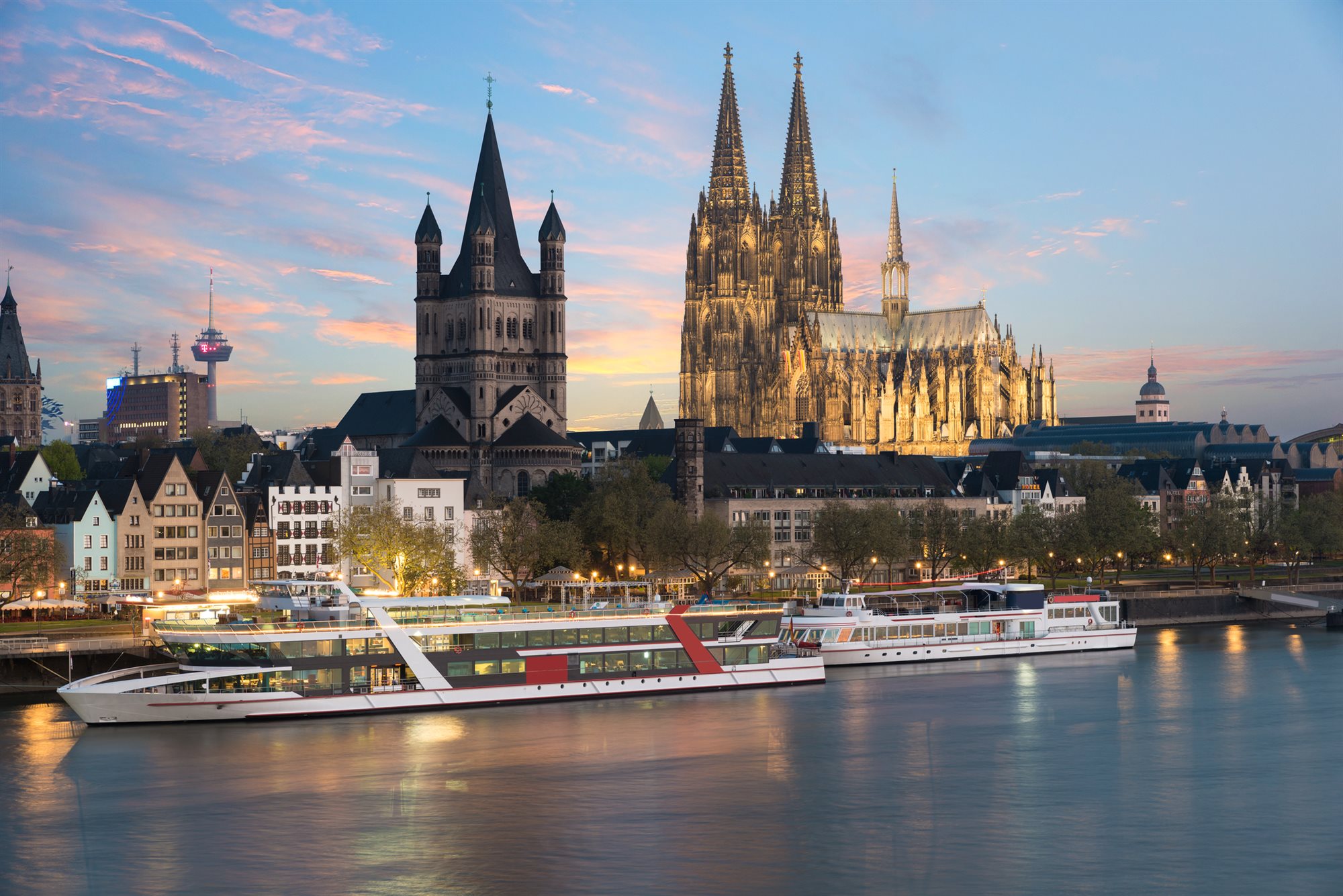 Avalon Waterways river ship docked in a historic European riverfront town